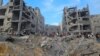 Palestinienii caută victime la locul atacurilor israeliene asupra caselor din tabăra de refugiați Jabalia din nordul Fâșiei Gaza, 31 octombrie 2023. 