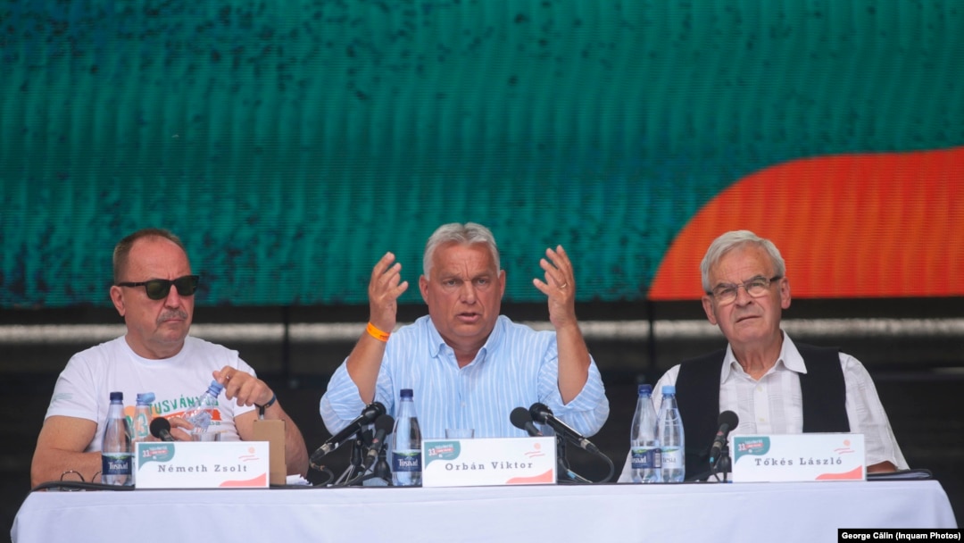 Viktor Orban (center) touched on many familiar issues during his nearly two-hour speech in a central Romanian spa town on July 27. 