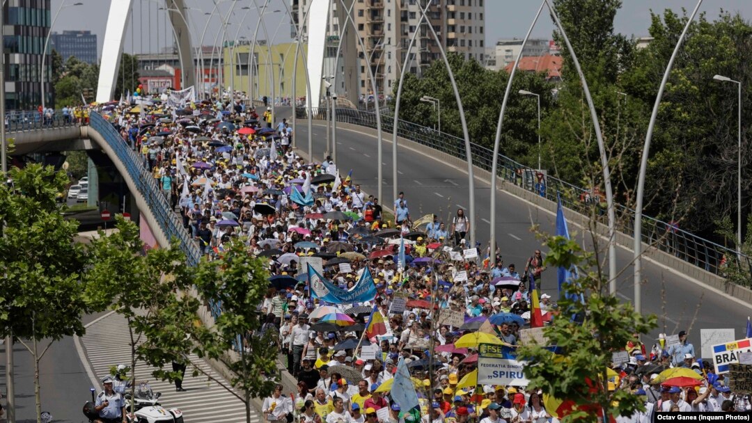 Romanian teachers march in Bucharest on June 9.