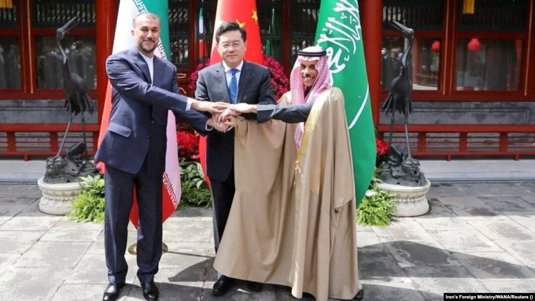 Iranian Foreign Minister Hossein Amir-Abdollahian (left), Saudi Arabian Foreign Minister Prince Faisal bin Farhan Al Saud (right), and Chinese Foreign Minister Qin Gang shake hands during a meeting in Beijing on April 6. 