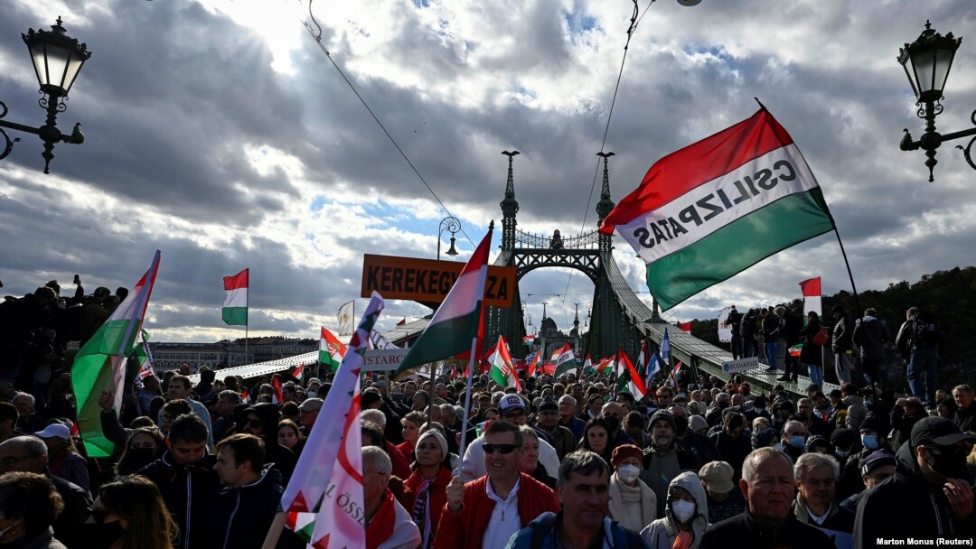 People attend a pro-government rally in Budapest during a commemoration of the 65th anniversary of the 1956 Hungarian Uprising on October 23. 