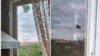 Nagorno-Karabakh - A house window in the village of Karmir Shuka piereced by bullets, Juy 28, 2022.