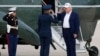 Donald Tramp Hərbi Hava Qüvvələrinin polkovnikini salamlayır