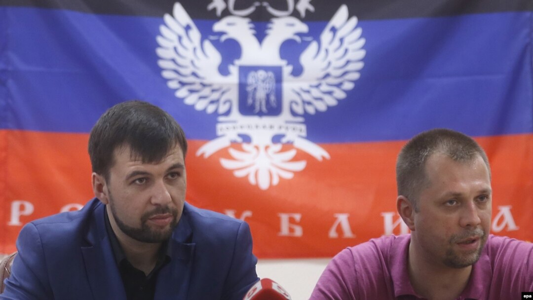 Pro-Russian separatist leaders Denis Pushilin (left) and Aleksandr Borodai in Donetsk, Ukraine, in late May