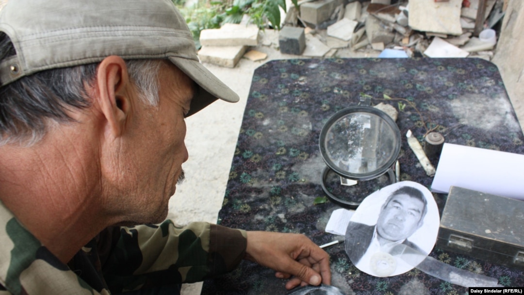 Rashid painstakingly chisels a portrait for a fresh gravestone. He says it can take him an entire week to complete a single tombstone, complete with portrait. They can sell for as much as 5,000 som, or $110. 