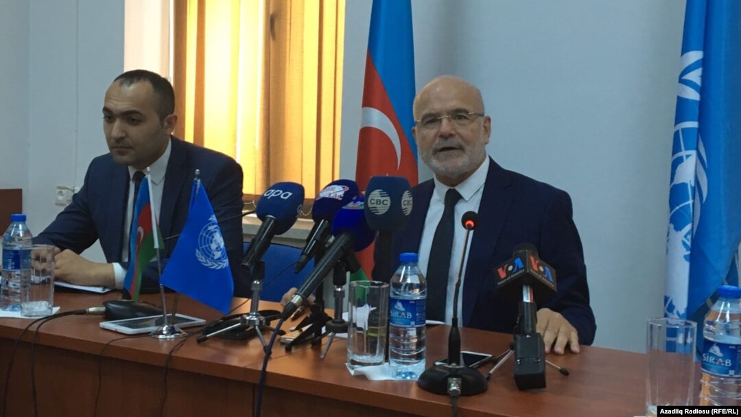 Michel Forst (right), the UN special rapporteur on the situation of human rights defenders, addressing reporters in Baku on September 22.