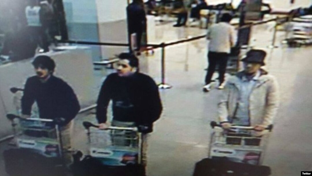 This police photo shows the two suspected suicide bombers in the airport attacks and an unidentified third man, at right.