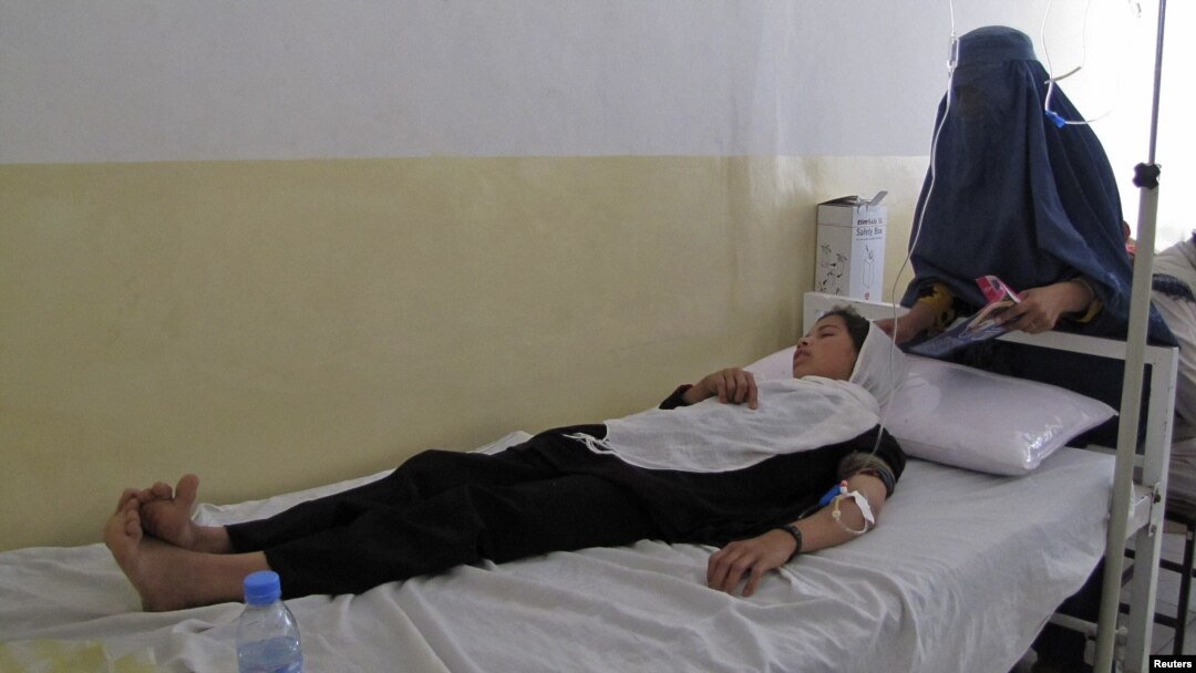 A schoolgirl receives treatment at a hospital after being poisoned in Takhar Province on May 23.