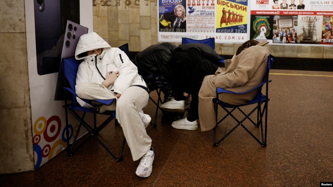 People take shelter in a subway station during a Russian missile strike in Kyiv on March 24.