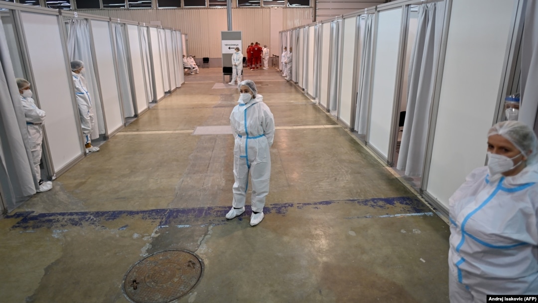 Medical workers wait for Serbian Army personnel before they receive a dose of the Chinese-made Sinopharm vaccine at a newly established vaccination center in Belgrade on January 19.