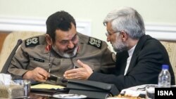 حسن فیروزآبادی (سمت چپ) همراه با سعید جلیلی در نشست مجمع تشخیص مصلحت نظام.