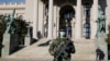 SERBIA -- A Serbian army soldier patrols in front of the parliament building as the number of coronavirus disease (COVID-19) cases grow around the world, in Belgrade, March 16, 2020