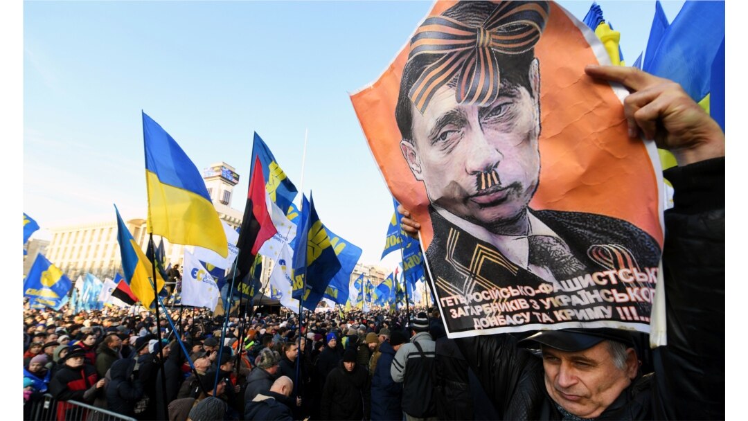 Плакат із зображенням президента Росії Володимира Путіна під час акції «Червоні лінії для Зе». Київ, 8 грудня 2019 року