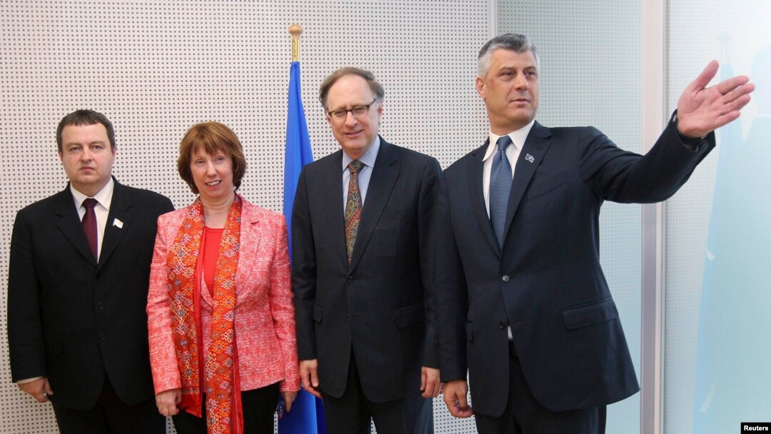 Serbian Prime Minister Ivica Dacic, European Union foreign policy chief Catherine Ashton, NATO Deputy Secretary-General Alexander Vershbow, and Kosovar Prime Minister Hashim Thaci (left to right) pose at NATO headquarters in Brussels on April 19, when the deal was initialed.