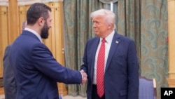US President Donald Trump (right) shakes hands with Syria's interim President Ahmed al-Sharaa in Riyadh on May 14.