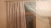 Armenia - A bullet hole on a window glass in a house in the village of Khoznavar, April 23, 2025.