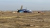Спасатели на месте крушения самолета авиакомпании Azerbaijan Airliner 