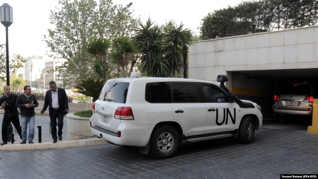 UN vehicles carrying the fact-finding team of the Organization for the Prohibition of Chemical Weapons arrive at the Four Seasons hotel in Damascus on April 14.