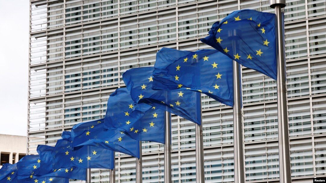 European Union flags flutter outside the EU Commission headquarters in Brussels