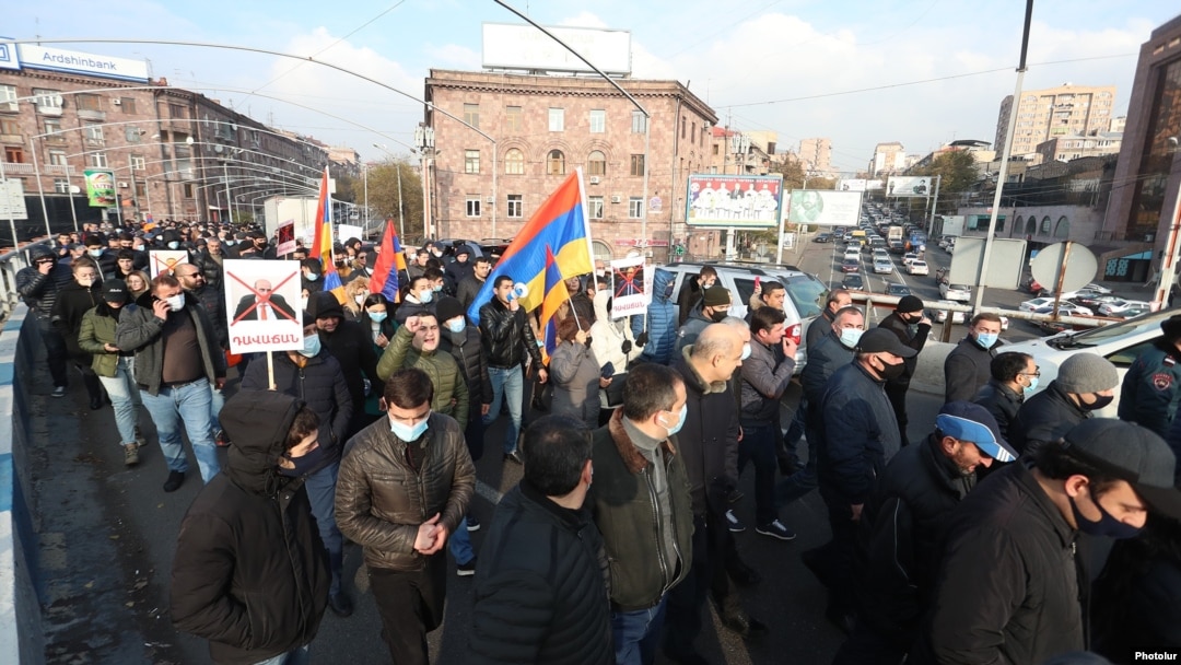 Protesters chanted, "Armenia without Nikol" and "Nikol must go!" as they flooded streets in the center of the Armenian capital on December 11.