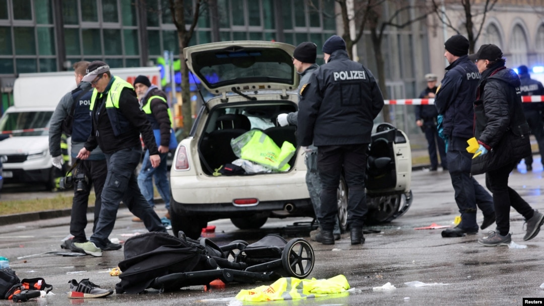 Police investigate the scene after an Afghan asylum seeker drove a car into a crowd in Munich, injuring 28 people. 